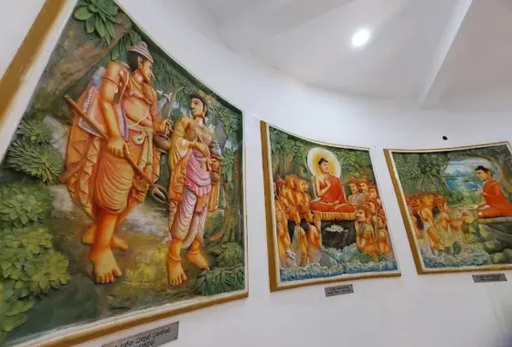 Kandyan era Jataka murals and serene Buddha statue in Madavilgoda Temple shrine room